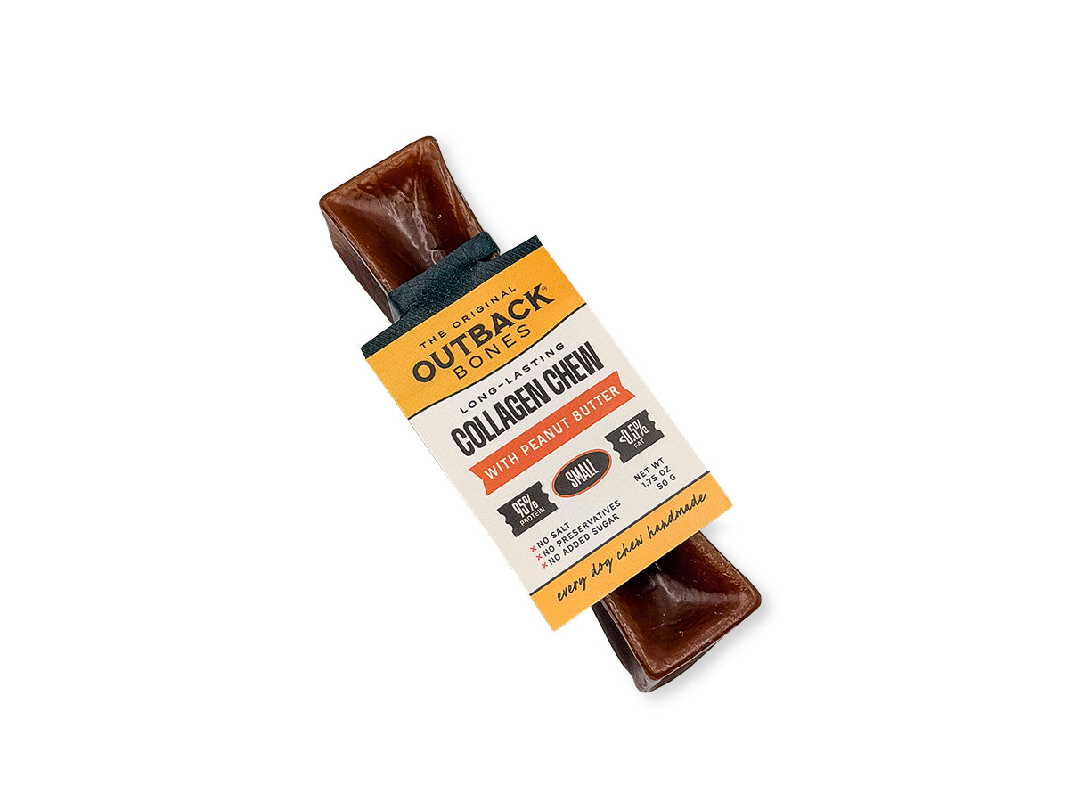 Peanut butter collagen chew lying flat with its Outback Bones card tag, on a white background