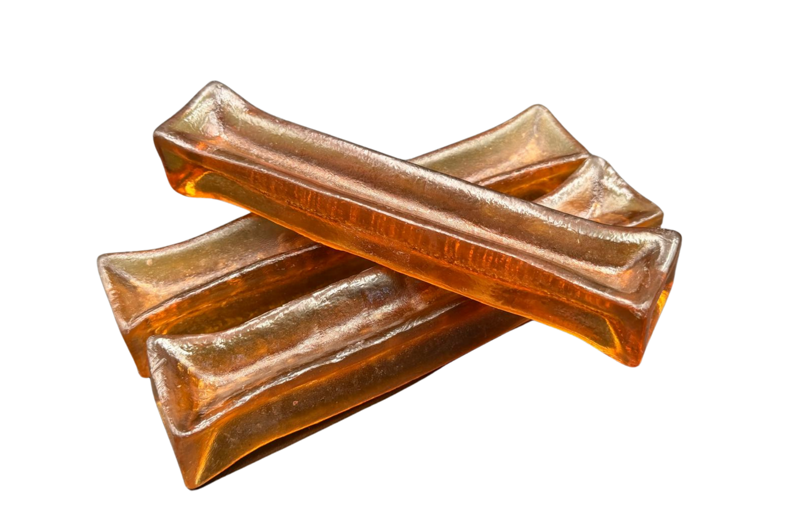 Three amber collagen chews stacked in a crossed pile, cut out on white