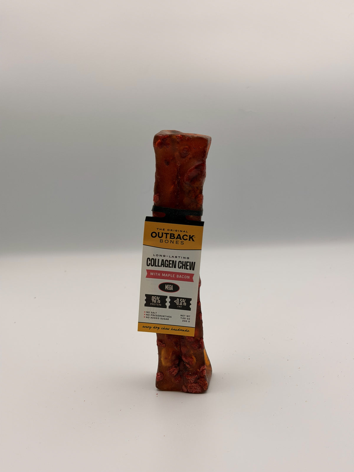 Maple bacon collagen chew standing upright, card tag face-on reading Long-Lasting Collagen Chew with Maple Bacon